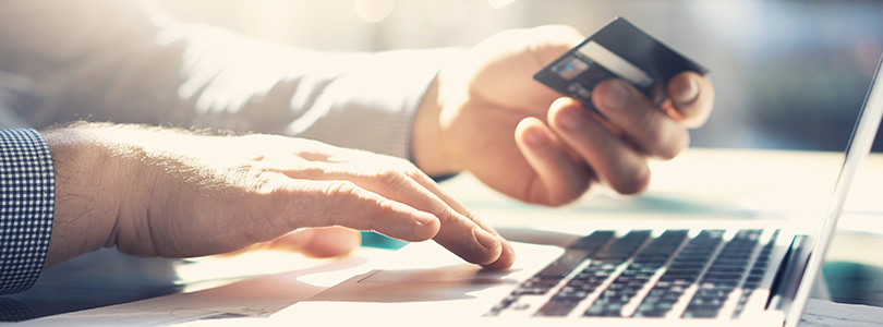 Laptop and Hand with Credit Card