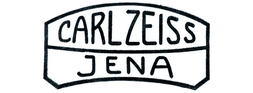 Lens logo with writing "Carl Zeiss Jena"